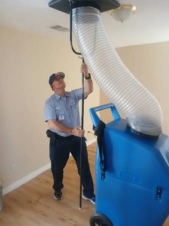 HVAC Installation technician using HEPA equipment in Neptune